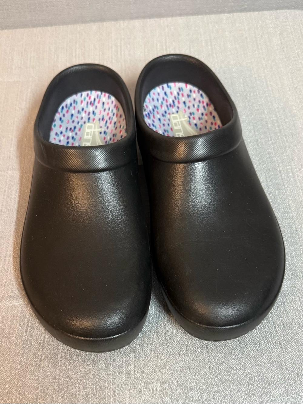 Dansko Black Slip-On Clogs with Multicolor Dotted Insole
